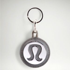 - BNWT Logo Bag Charm & Keychain- Color is called Silver/Grey Sage.